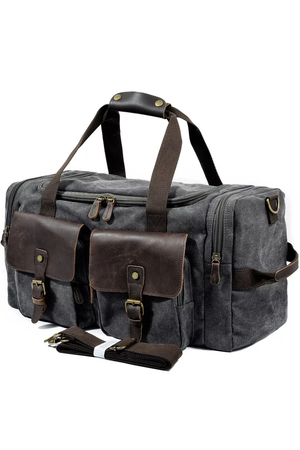 Priestranná cestovná taška s koženými detailmi úložný priestor kompletne podšitý zapínanie dvojcestným zipsom